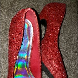 very shiny, red heels 2-3 inches.